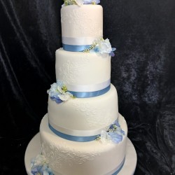 front blue and white ribbon wedding cake 