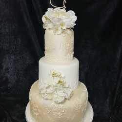 ivory wedding cake two hearts on top